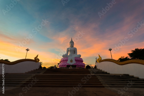White Buddha on sunset sky,Buddhas of Buddhists in Thailand