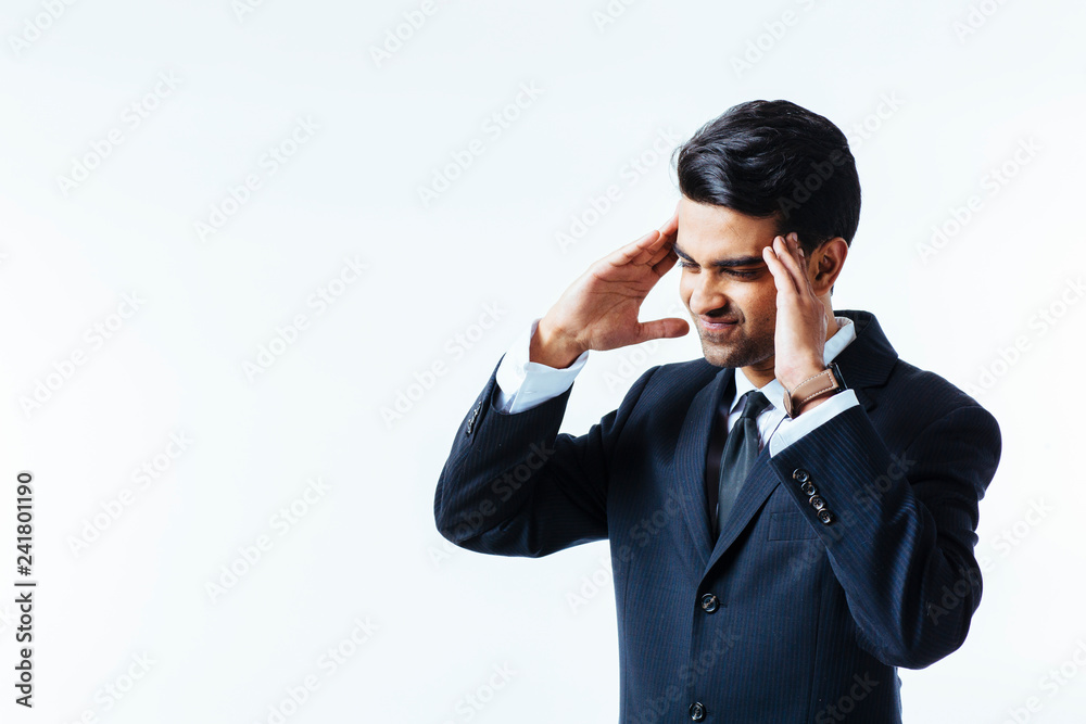 Portrait of a handsome businessman holding his head in disbelief, in pain or meditating, isolated on white background. Portrait of a handsome businessman holding his head in disbelief, in pain or meditating, isolated on white background.