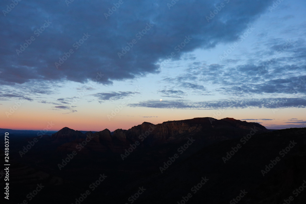 Sunrise Over Desert Mountains with Clouds in the Sky Sunrise Over Desert Mountains with Clouds in the Sky