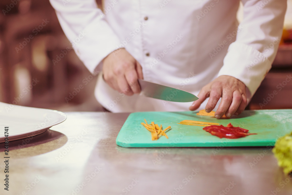Chef hands cutting fresh and delicious vegetables Chef hands cutting fresh and delicious vegetables