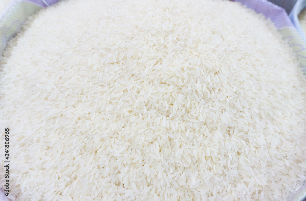 jasmine rice in plastic bag from Thai farmer sale per kilogram,for cooking,blur bacground jasmine rice in plastic bag from Thai farmer sale per kilogram,for cooking,blur bacground