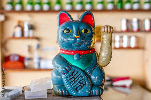 Asian lucky cat statuette. Bali island, Indonesia. Asian. Lucky symbol.