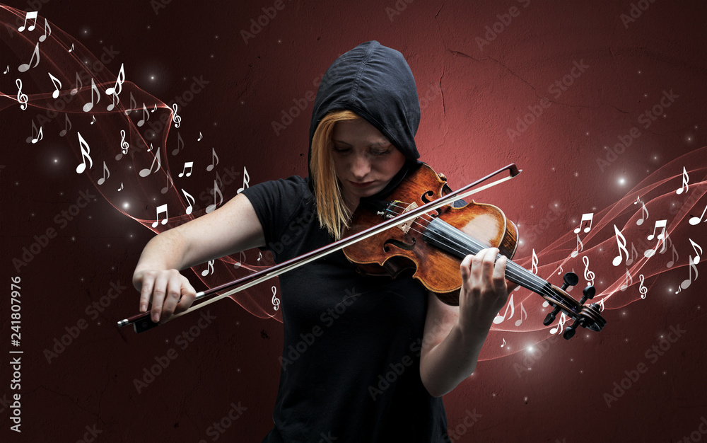 Fototapeta premium Lonely musical composer with violin and sparkling musical notes around