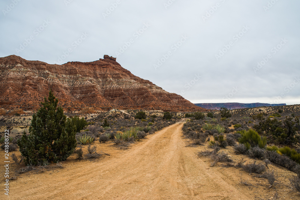 Road towards cliffs in the Southern Utah desert 