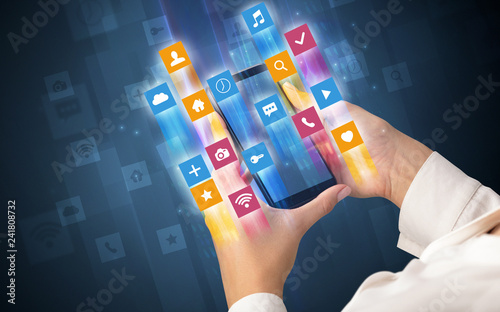 Female hand using smartphone with colorful angular fast switching application icons around photo