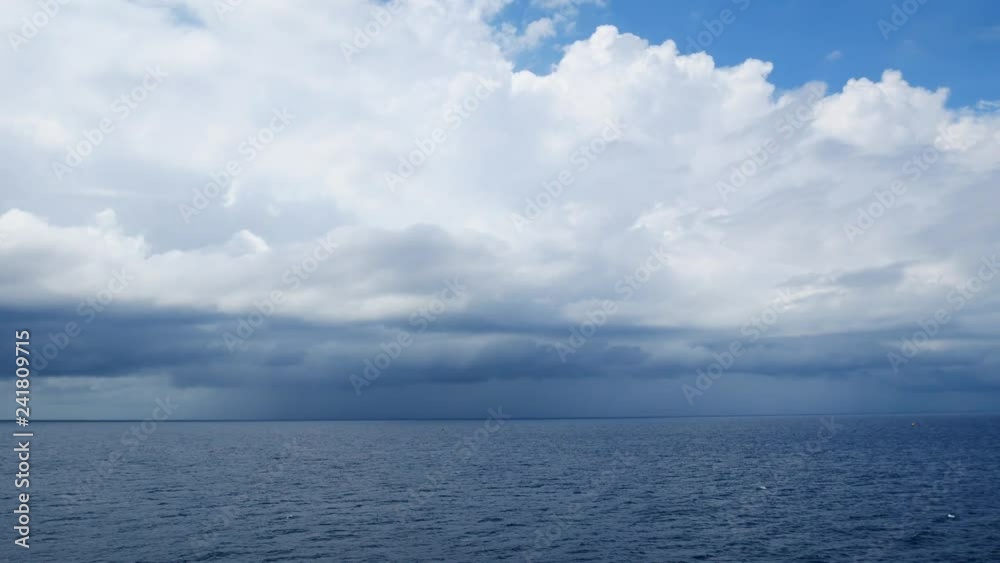 Stormy weather, high wind and wave in the middle of the ocean with dark clouds before storm Stormy weather, high wind and wave in the middle of the ocean with dark clouds before storm