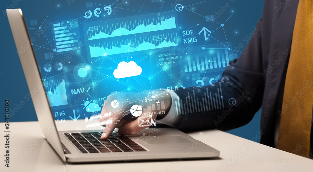 Businessman hand typing on laptop with reports and graphs concept around
Businessman hand typing on laptop with reports and graphs concept around