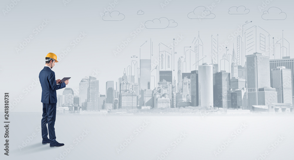 Young supervisor architect standing and replanning a big city panorama
Young supervisor architect standing and replanning a big city panorama