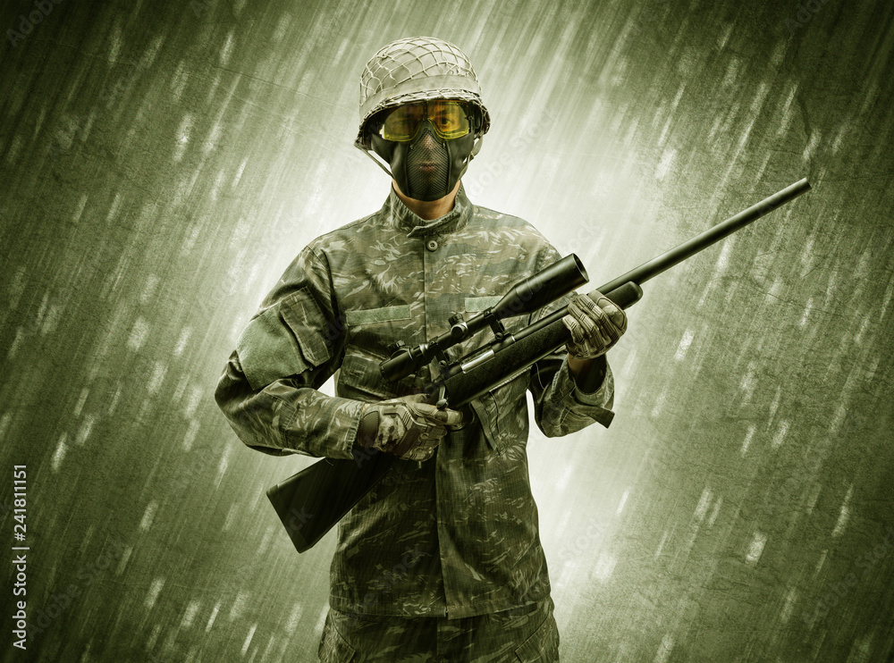 Armed soldier standing in rainy weather
Armed soldier standing in rainy weather