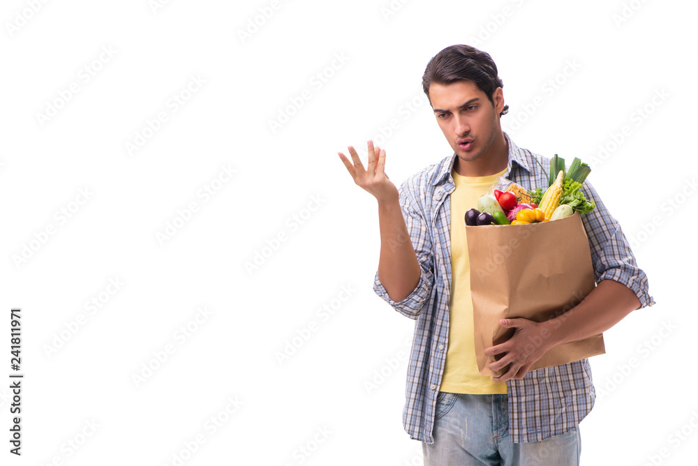 Young man with his grocery shopping on white Young man with his grocery shopping on white