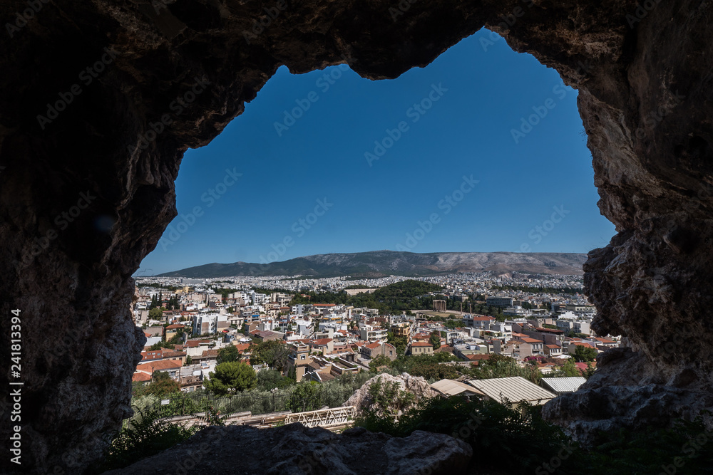 Athens from inside the largest cave on the East Slope of the Acropolis