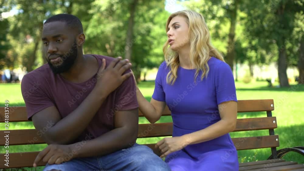 Sad woman sorrying boyfriend for cheating, sitting on bench in park, break-up Sad woman sorrying boyfriend for cheating, sitting on bench in park, break-up
