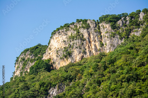 High mountains, beautiful blue skies, green trees created by nature in Thailand
