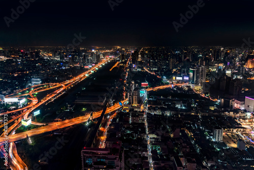 The big city at night with the lights illuminating the streets and along the tall buildings