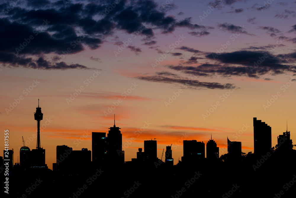 sydney city in silhouette at sunrise