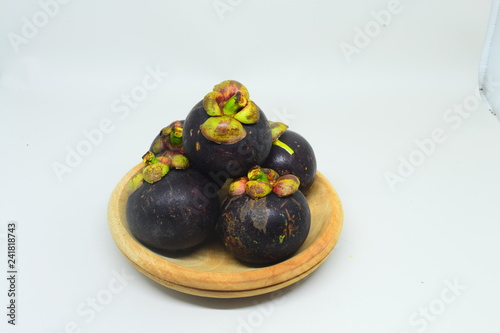 Mangosteen isolated on white background. Mangosteen, the famous exotic delicious tropical fruits from Thailand. Mangosteen also known as Queen of fruits. 