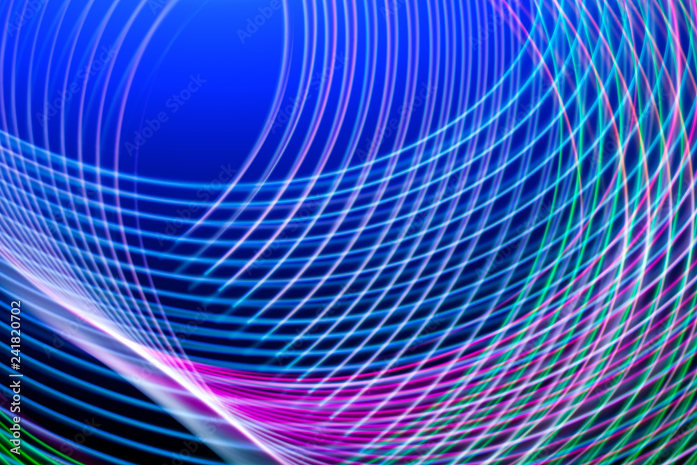 Fototapeta premium Abstract light blue, pink and purple trails in random motion background image. Striped Neon Lights in Rainbow Colors