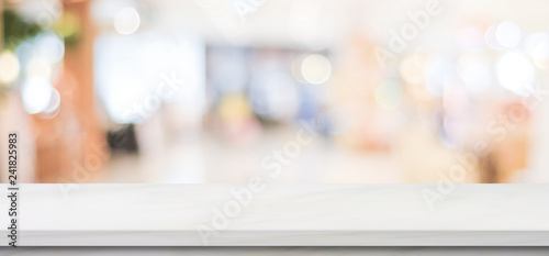 Empty white marble table over blur store background, banner, product display montage