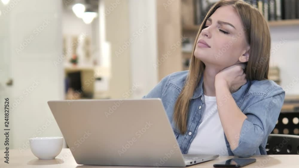 Creative Woman with Neck Pain Busy Working on Laptop Creative Woman with Neck Pain Busy Working on Laptop