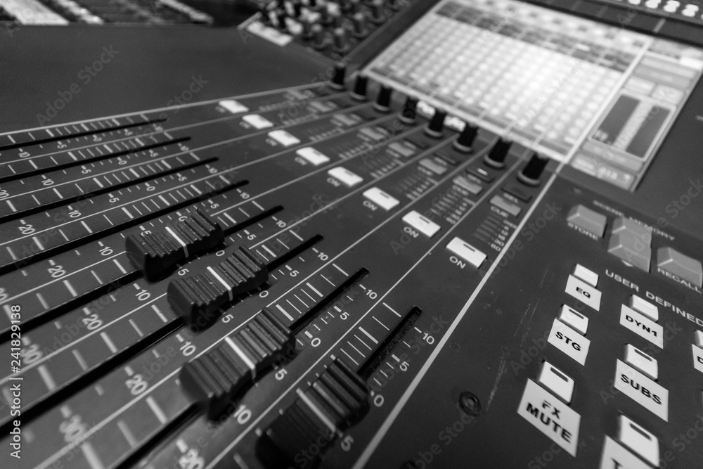 Closeup view of Faders on Professional digital Audio mixing control Console