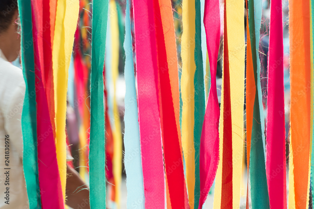 Multi colorful ribbons hang from above
