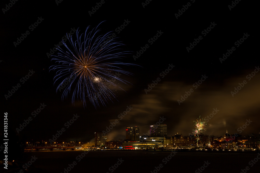 UMEÅ, SWEDEN - JANUARY 1, 2019 - New Year's Celebration with Fireworks UMEÅ, SWEDEN - JANUARY 1, 2019 - New Year's Celebration with Fireworks