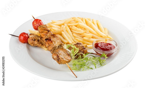 French fries with chicken skewer with red sauce. On white background