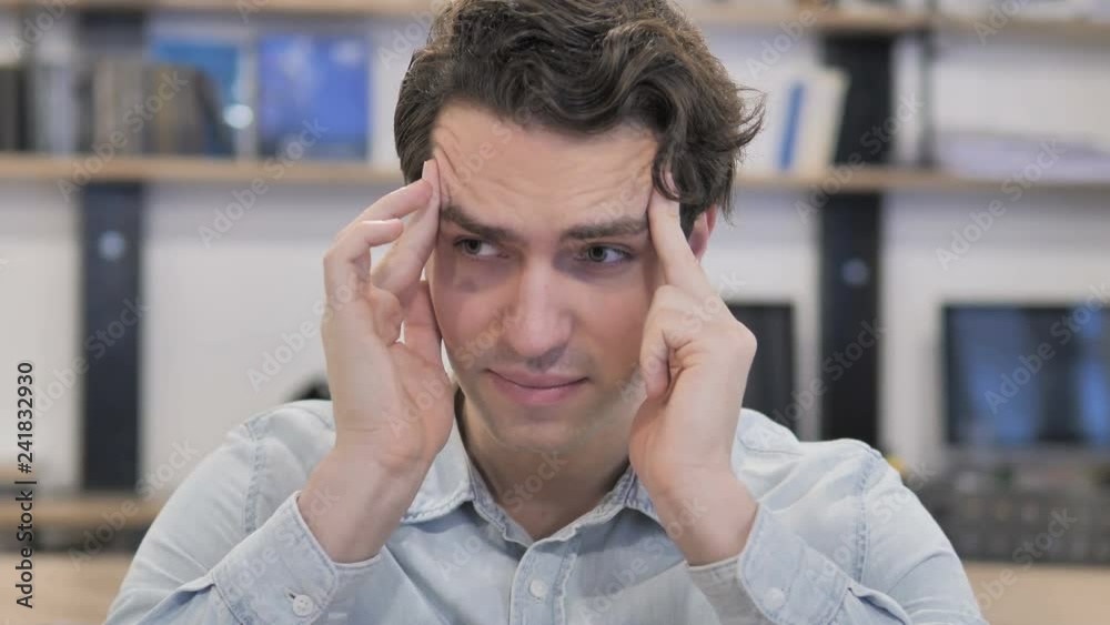 Headache, Portrait of Tense Creative Man in Office Headache, Portrait of Tense Creative Man in Office