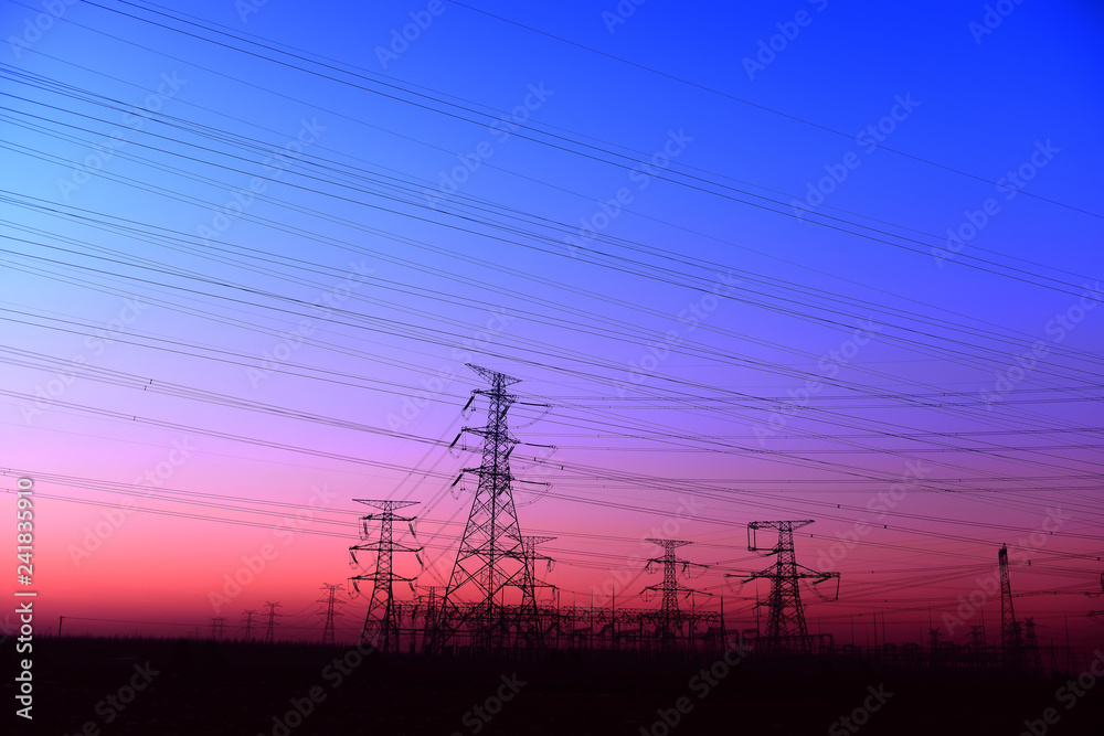 High piezoelectric towers, in the setting sun