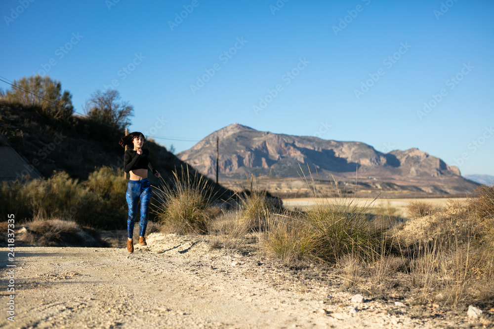 Woman doing sport and relaxing outdoors