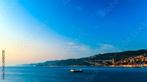 Fototapeta Naklejka Na Ścianę i Meble -  Colorful sunset in front of the city of Trieste