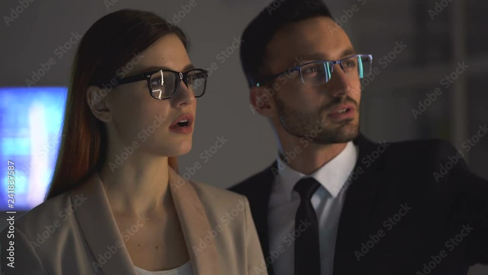 The businessman and a businesswoman discussing in the office