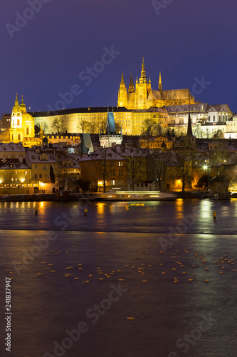 Night colorful snowy Christmas Prague Lesser Town with gothic Castle and Charles Bridge, Czech republic © Kajano