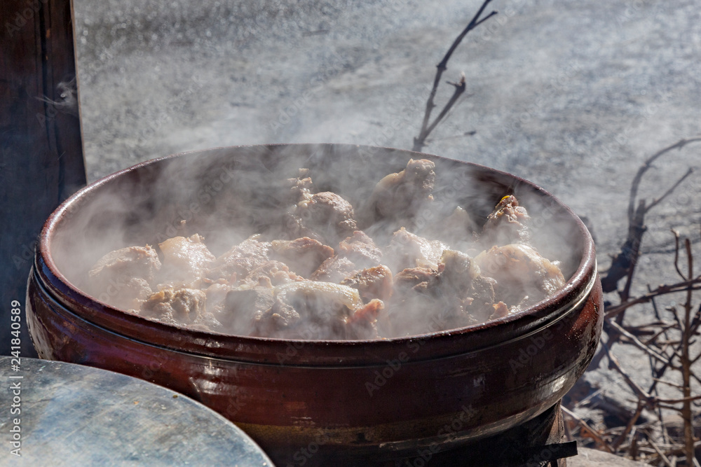 Drakona Greece, 12-14-2018 Traditional Cretan cooking over a wood fire in Crete Greece. Drakona Greece, 12-14-2018 Traditional Cretan cooking over a wood fire in Crete Greece.