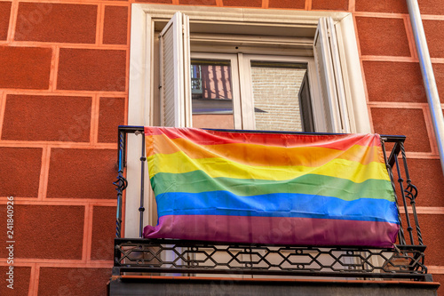 Homosexual rainbow flag on the balcony. street view. House with 