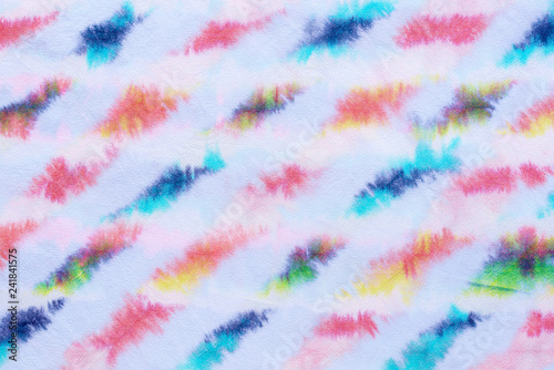 striped tie dye pattern hand dyed on cotton fabric abstract background.