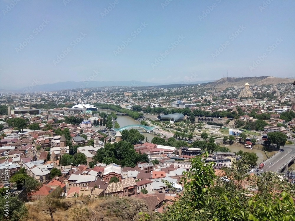 View of Tbilisi from Mtsatminda mountain. Old Town, new houses, the Kura River.