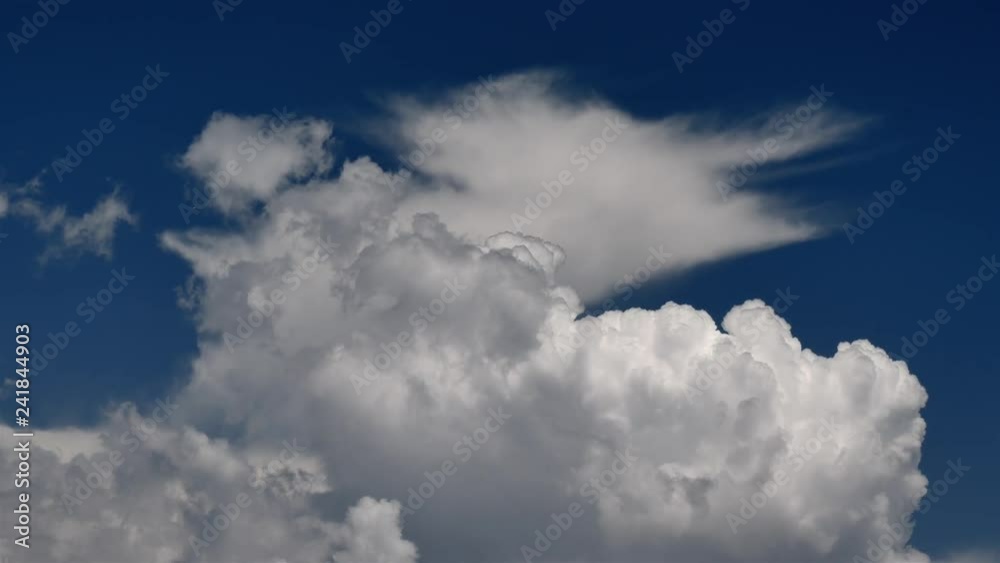 Timelapse of the moving clouds on a background of summer blue sky. Timelapse of the moving clouds on a background of summer blue sky.
