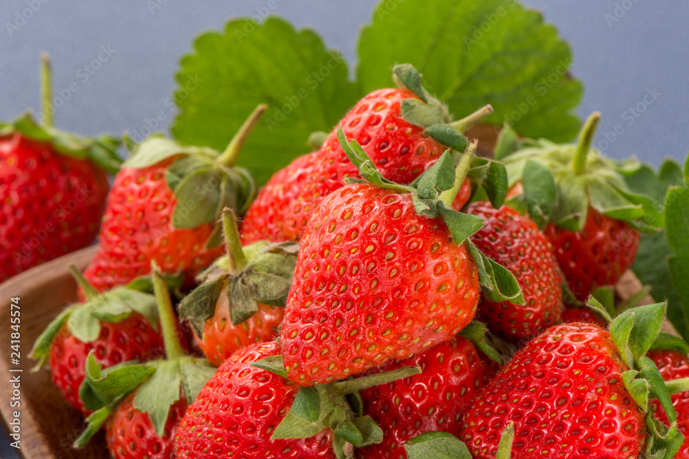 A beautiful and delicious strawberries set isolated on colorful background, close up, macro, copy space. A beautiful and delicious strawberries set isolated on colorful background, close up, macro, copy space.