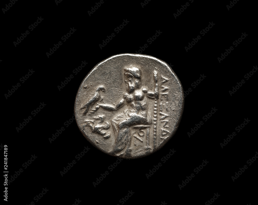 Ancient silver coin isolated on black Ancient silver coin isolated on black