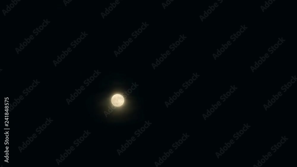 The moon passing through the night sky in accelerated shooting The moon passing through the night sky in accelerated shooting