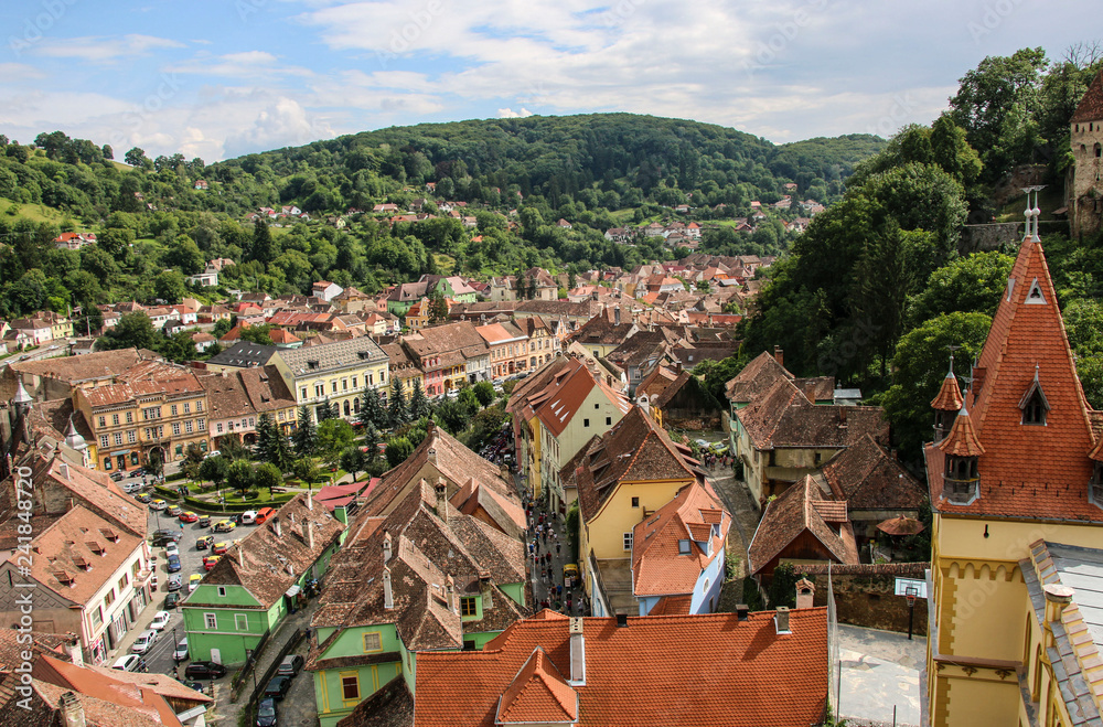 Obraz premium Panoramic view over the cityscape and roof architecture in Sighisoara, Romania