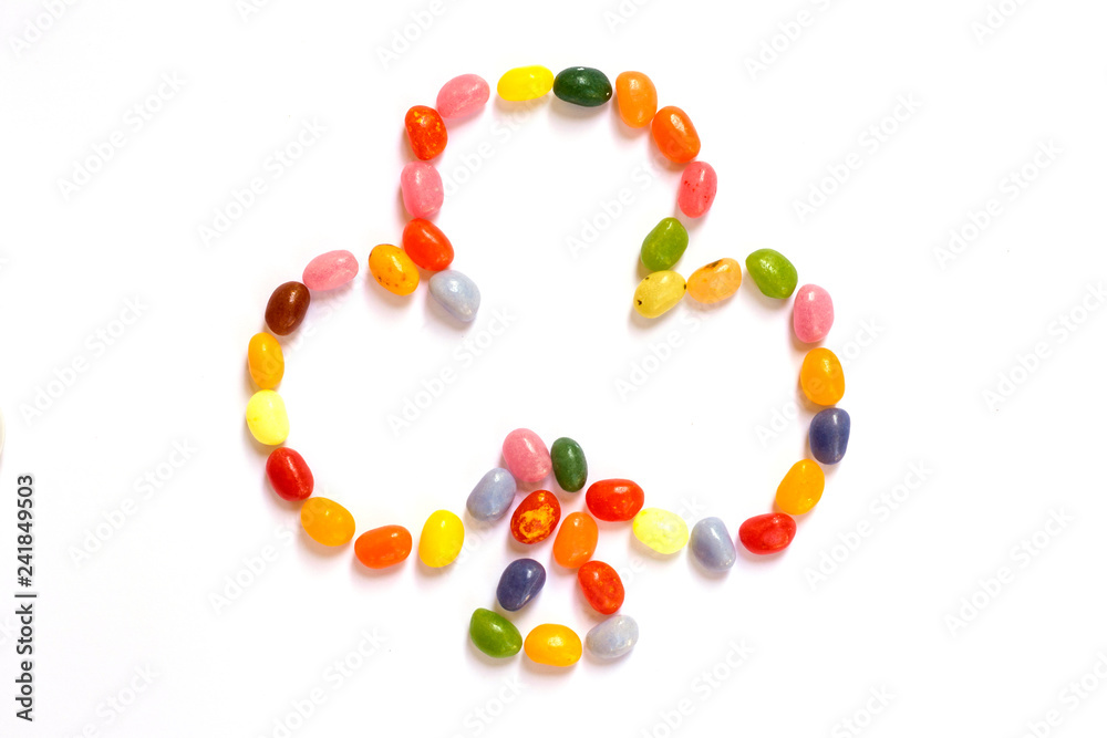 Clovers shape made of jelly beans isolated on white Clovers shape made of jelly beans isolated on white