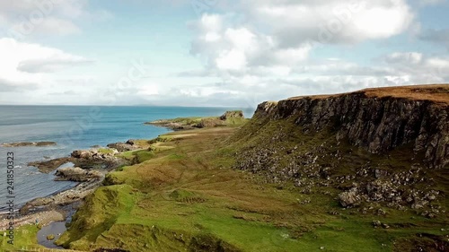 Flying over the Dinosaur bay with the rare Dinosaur footprint of the sauropod-dominated tracksite from Rubha nam Brathairean, Brothers Point - Isle of Skye, Scotland photo