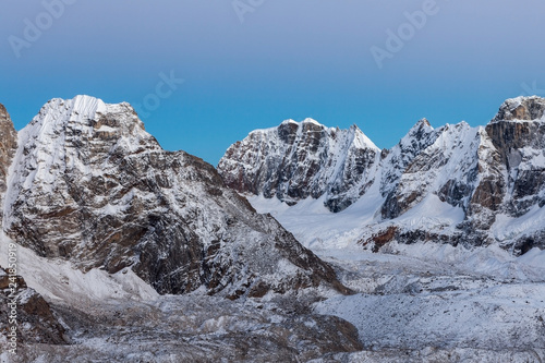Beautiful snow and ice covered mountains landscape and clear blue morning sky on Everest Base Camp Trek in Himalayas  Nepal. Adorable photo.