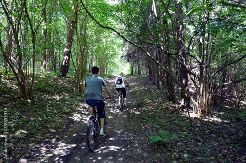 Riding bicycle in forest