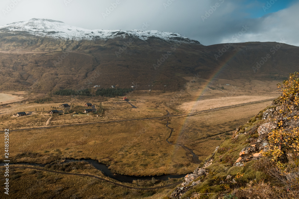 amazing Nordic landscape, Iceland. Travel and nature. Alpine cliff with rainbow