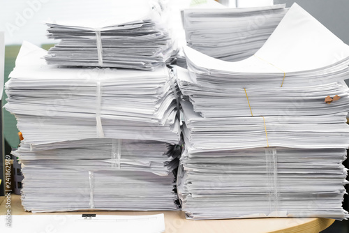 Fotografía Paper heap from hard work, useless paper
