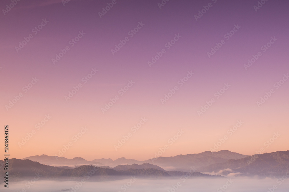 Foggy and mountain on edge range with copy-space on sky Foggy and mountain on edge range with copy-space on sky