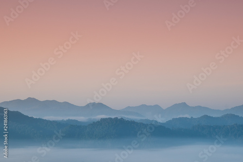 Foggy and mountain on edge range with copy-space on sky